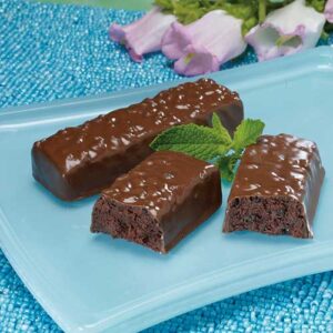 A plate of chocolate bars with mint leaves.