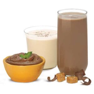 A bowl of chocolate pudding next to two glasses of milk.
